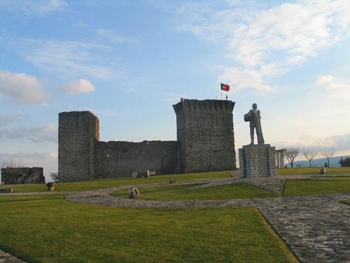 a statue of a man standing on top of a castle at Hotel Lux Fatima in Fátima