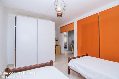 Postel nebo postele na pokoji v ubytování Akivillas Lagos Beach III