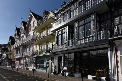 a row of buildings on a city street at THE ANGEL 1 BEST VIEWS IN DARTMOUTH in Dartmouth