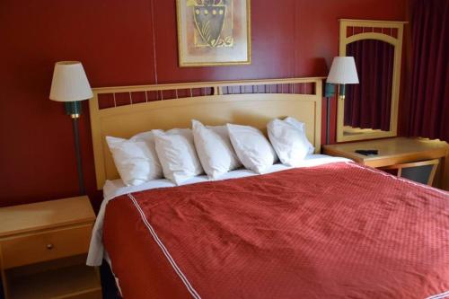 Postel nebo postele na pokoji v ubytování Relax Inn