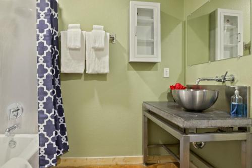 a bathroom with a sink and a shower at LiivUP Warehouse Apartments in New Orleans