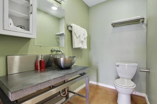 a bathroom with a sink and a toilet at LiivUP Warehouse Apartments in New Orleans