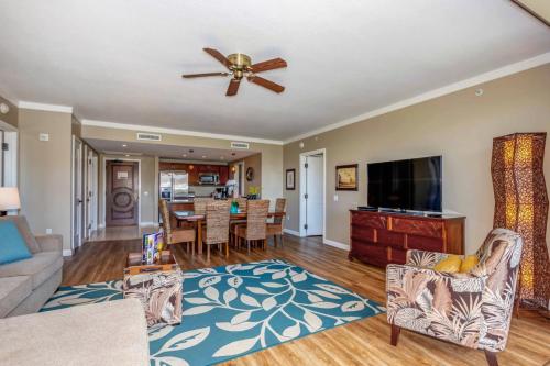 a living room with a couch and a ceiling fan at Honua Kai - Konea 642 - Ocean View from inside! 2b/2b in Kaanapali