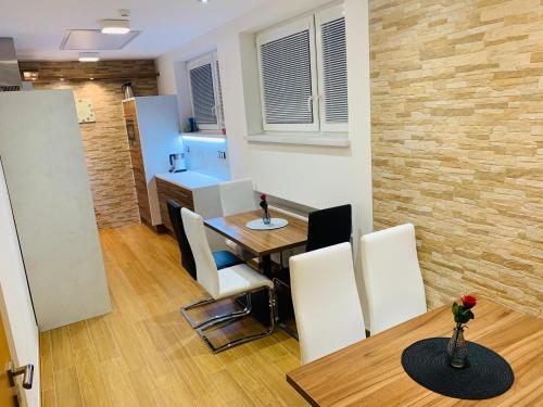 a kitchen and dining room with a table and chairs at Výšinka 719 in Turnov