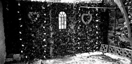 a stone wall with a window at BELFAST COSY CABIN in Belfast