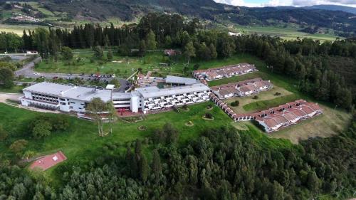 an aerial view of a large building on a field at D'Acosta Hotel Sochagota in Paipa