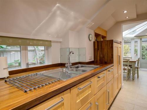 a kitchen with a sink and a counter top at Sunnyside Cottage in Bampton