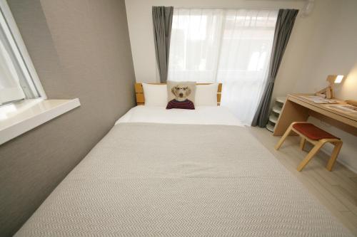 Ένα ή περισσότερα κρεβάτια σε δωμάτιο στο goom Hotel Fukuoka-Kokusai-Center