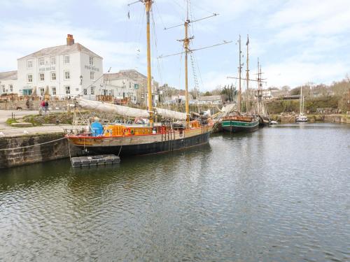 two boats are docked in a body of water at Oh Buoy! in Charlestown