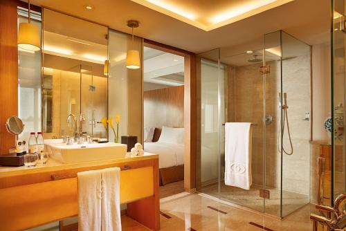 a bathroom with a sink and a shower at Sofitel Xi'an On Renmin Square in Xi'an