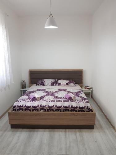 a bedroom with a bed in a room at Modern Apartment Doris in Kotor
