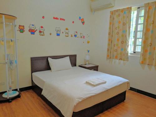 Postel nebo postele na pokoji v ubytování Jin Xi Fu B&B