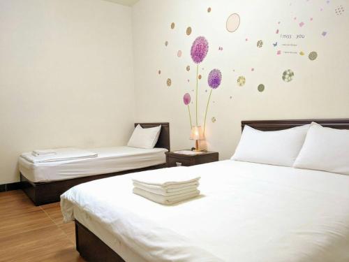 Postel nebo postele na pokoji v ubytování Jin Xi Fu B&B