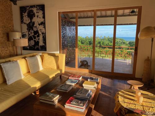 a living room with a couch and a coffee table at Balian Prana in Selemadeg