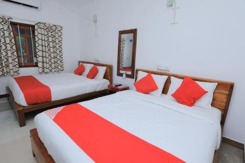 Una cama o camas en una habitación de Trinco Star Cabana