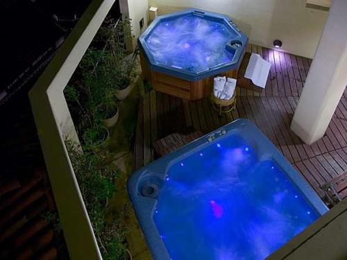 an overhead view of a large blue tub in a room at Poppy Springs Resort & Spa in Mimasaka