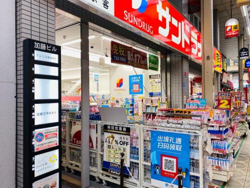 a store with many items on display in a supermarket at bnb+ Shinsaibashi in Osaka
