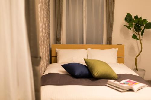 Cama o camas de una habitación en Hotel ONE'S RESIDENCE