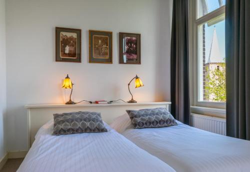 Katil atau katil-katil dalam bilik di B&B De Postoari Terschelling