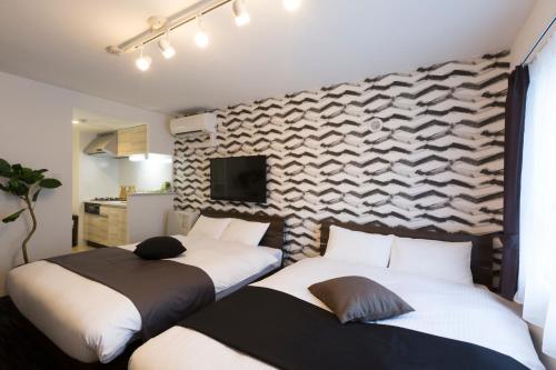Cama o camas de una habitación en Hotel ONE'S RESIDENCE