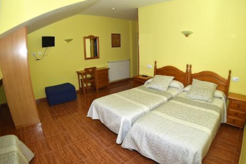 A bed or beds in a room at Montaña Palentina