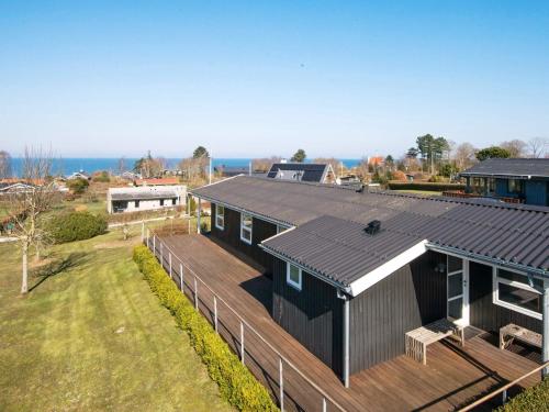 an overhead view of a black house with a deck at 6 person holiday home in Alling bro in Rygård Strand
