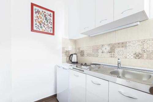 A kitchen or kitchenette at Apartments Natasa