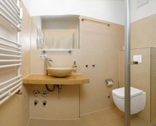 a bathroom with a sink and a toilet at App Seaside in Insel Poel