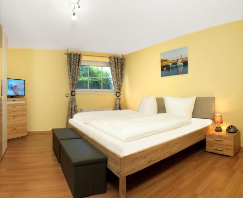 Postel nebo postele na pokoji v ubytování Strandglück
