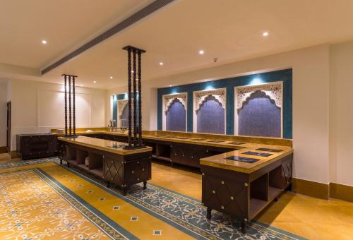 a bathroom with two sinks in a room at Sairafort Sarovar Portico in Jaisalmer