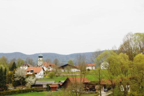 a small town with a clock tower in the distance at Gästehaus Fidelis in Grafenwiesen