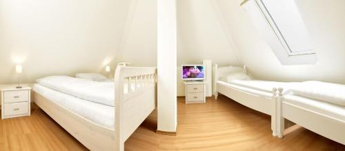 Katil atau katil-katil dalam bilik di Appartements Am Reiterhof Nixe