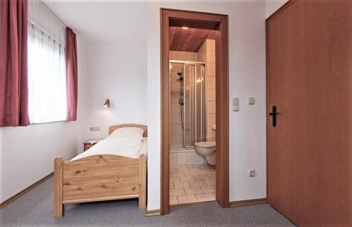 Кровать или кровати в номере Gästehaus Fidelis