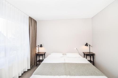 Postel nebo postele na pokoji v ubytování Bella Apartments & Rooms