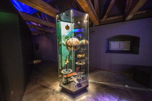 a glass case with three sinks in a room at Zámek Žďár in Žďár nad Sázavou