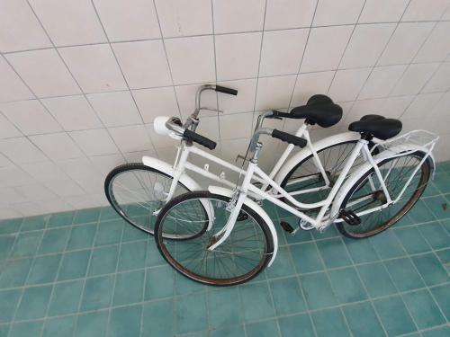 a white bike is parked in a room at Duna Dráva Vendégház in Érsekcsanád