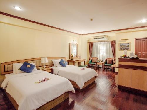 Кровать или кровати в номере Patumwan House