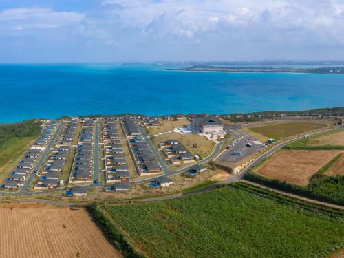 an aerial view of a parking lot next to the ocean at Miyakojima Kurima Resort Seawood Hotel in Miyako Island