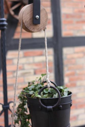 a potted plant is hanging from a chain at Harz-Chill Wernigerode in Wernigerode