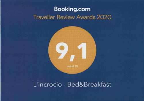 a sign that reads traveler review awards in a circle at L'incrocio - Bed&Breakfast in Imola
