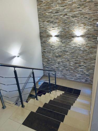 a staircase in a building with a brick wall at Výšinka 719 in Turnov
