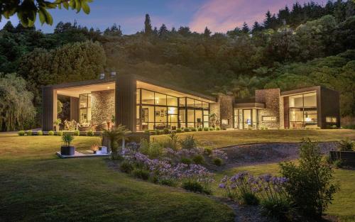 a house on a hill with a garden at The Jewel of Akatarawa in Upper Hutt