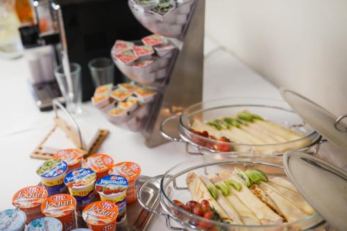 a buffet with sandwiches and dip and other snacks at Biała Akacja Resort & Business in Prudnik