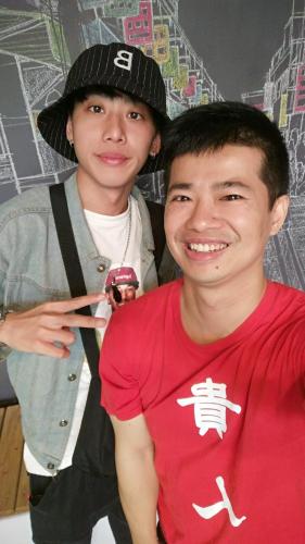 two young boys are posing for a picture at mydeer backpacker in Tainan