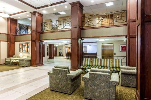 a lobby with couches and chairs in a building at La Quinta by Wyndham Milwaukee Bayshore Area in Glendale