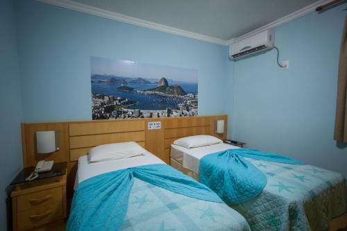 Postel nebo postele na pokoji v ubytování Hotel Saint Louis