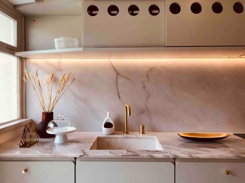 a bathroom with a sink and a counter top at INCREDIBLE DUPLEX PENTHOUSE & TERRACES & Parking in Porto