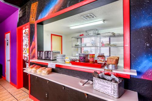 a fast food kitchen with a counter with food at Sin City Hostel in Las Vegas