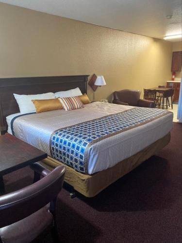 a bedroom with a large bed in a room at royal inn in Lovelock