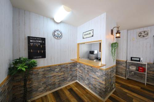 a coffee shop with a stone counter and a sign on the wall at Prosper 6th bldg in Nagoya